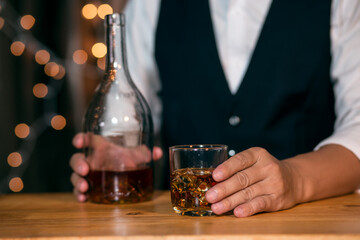 Barman pouring whiskey whiskey glass beautiful night