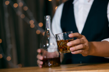 Barman pouring whiskey whiskey glass beautiful night