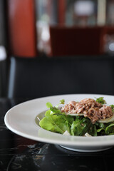 Tuna salad appetizer on wood background