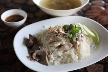 Thai food gourmet steamed chicken with rice in wood background