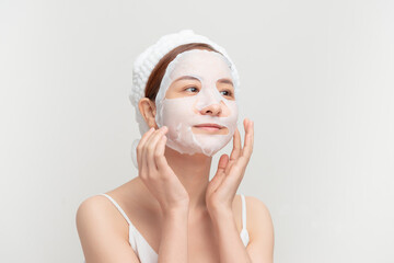 Closeup beauty portrait of beautiful woman with a mask on her face for treatment