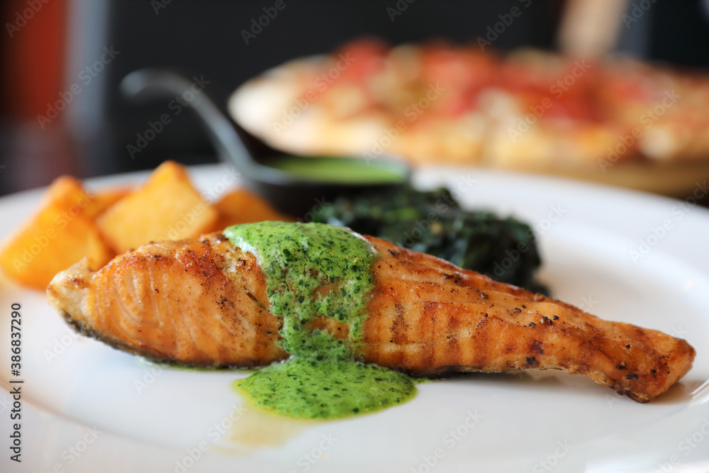 Wall mural salmon steak with pesto sauce