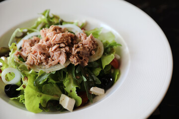 Tuna salad appetizer on wood background