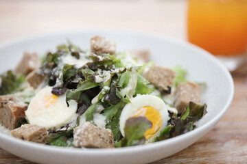 caesar salad appetizer on wooden background