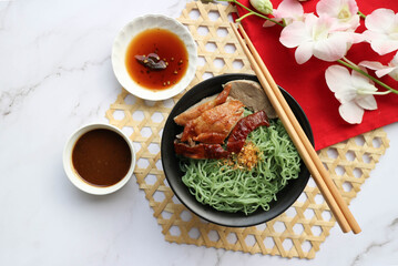 Roasted duck noodles on white marble background, Thai-Chinese food called Mee Yok Ped Yang - top view copy space