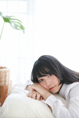 girl sleeping on bed in white room