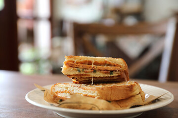 Panini with ham and sausage sandwich