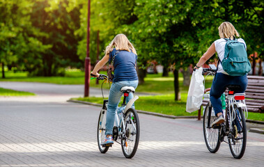 Cyclists ride on the bike path in the city Park
