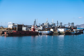 Fototapeta premium Ships and boats anchored in old port of Drapetsona Piraeus Greece, sunny day.