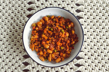 plant-based food, vegan stew with garden vegetables butter beans and spicy tomato sauce