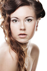Fototapeta premium Face of a sexy beautiful young woman with clean skin on a white