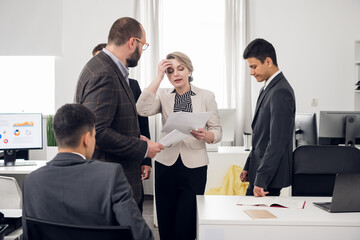 Planning session for young businessmen in the co-working office. Discussion of a new startup and ideas for business promotion