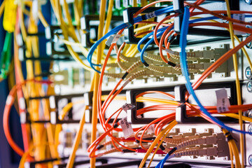 detail of server rack with fiber optic cables attached to front