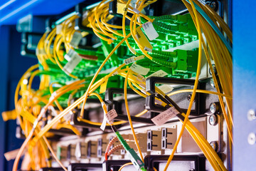 detail of server rack with fiber optic cables attached to front