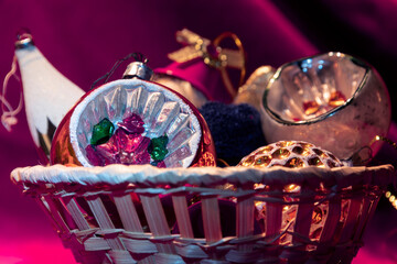 The Basket with Old Christmas baubles. Selective focus.