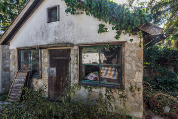 old overgrown little house in the forest