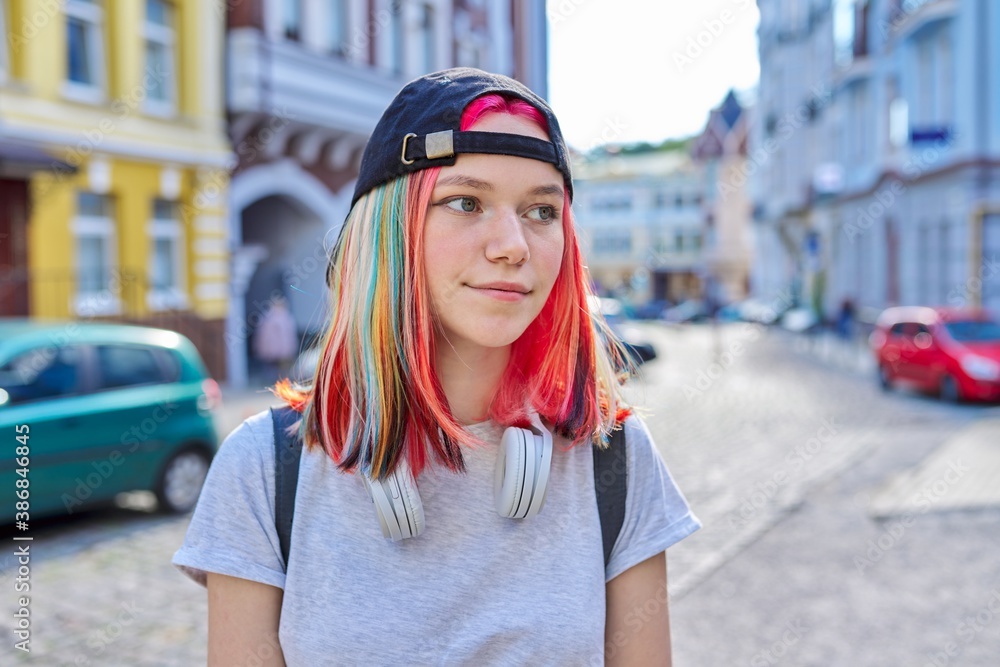 Poster Portrait of fashionable hipster teenage girl with colored dyed hair in black cap