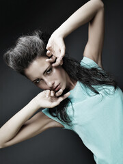 Fototapeta premium beautiful brunette girl in a blue dress