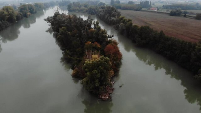 Autumn aerial image of a river during fog.