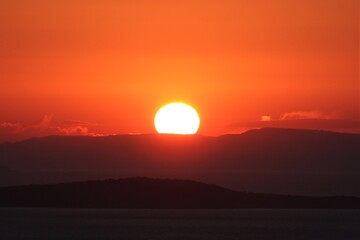 Panoramic view of Aegean sea during sunset. Sunset view during bright weather from Devil's Dinner Table in Ayvalk, Balikesir, Turkey.
