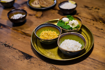 Asian style food, bowls with white rice, cauliflower in florets and lentil.
