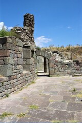 Theatre of The Asclepion of Pergamon Ancient City. Bergama, Izmir, Turkey. Relics, Roman columns, gates during sunny day and blue sky.