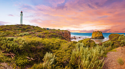 Sunset over Split Point Lighthouse and Eagle rock on Great Ocean Road in Australia