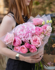 Colorful flowers assorted bouquet in bright paper