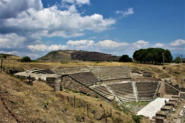 Fototapeta na wymiar Theatre of The Asclepion of Pergamon Ancient City. Bergama, Izmir, Turkey. Relics, Roman columns, gates during sunny day and blue sky.