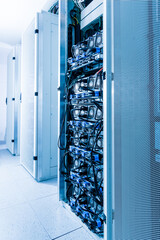 Racks filled with computer hardware inside internet datacenter