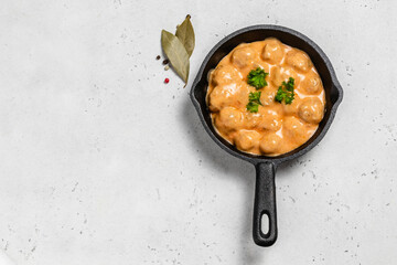 Italian meatballs in cast iron skillet. space for text.