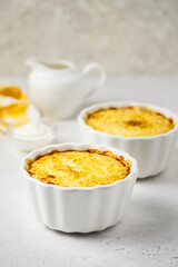 Baked porridge in baking dishes. Space for text.