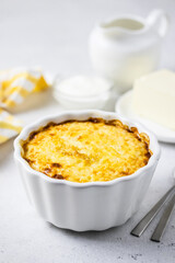 Baked millet rice porridge, casserole in baking dishes. Space for text.