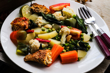 Sea fish and mixed vegetables stir fry.
