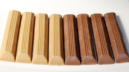 Black and white chocolate on a white background