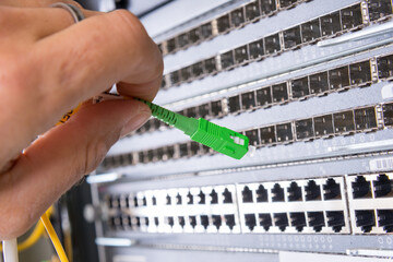 hand with fiber optic cable