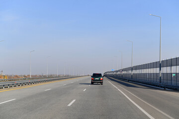 Fototapeta premium road, highway, sky, asphalt, travel, car, way, transportation, traffic, street, freeway, speed, drive, landscape, transport, motorway, driving, blue, empty, clouds, line, lane, nature, fast, trip
