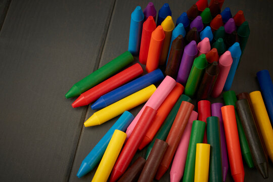 pile of school colored crayons to paint and color