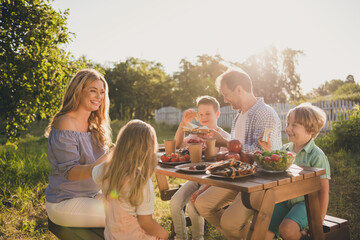 Photo of full big family five people three little kids sit bench table relax delicious dinner eat sandwich apples salad generation sunny weekend comfort home park backyard outdoors