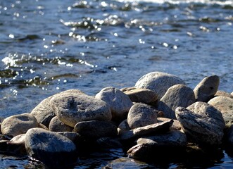rocks on the river in the sun - 386855805