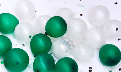 Small  balloons green and white color on floor background