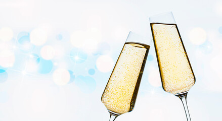 two glasses of champagne on a defocus background