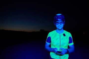 athlete cyclist having a break using smart phone