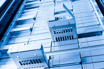 Obraz premium detail of data center with some of hard drive bays open