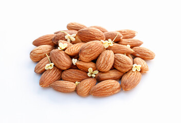 Group of dry almond nuts with sweet osmanthus flowers isolated on white background