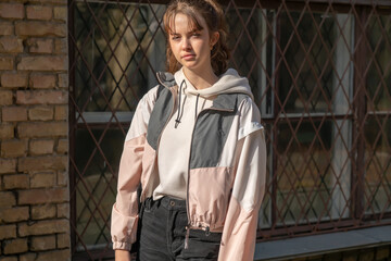 Solemn young teenage girl in evening sunshine