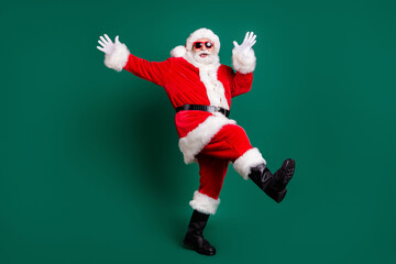 Plakat Full length body size view of his he nice attractive handsome carefree cheerful cheery Santa having fun dancing rest relax amusement celebratory festive day isolated over green color background