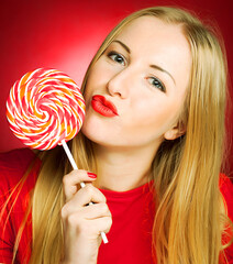 woman holding lollypop