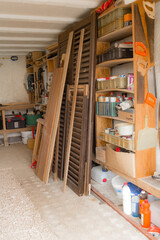 Various carpenter's tools and supplies in a garage.