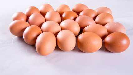 Close-up of fresh brown eggs ,side view,copy space,background,